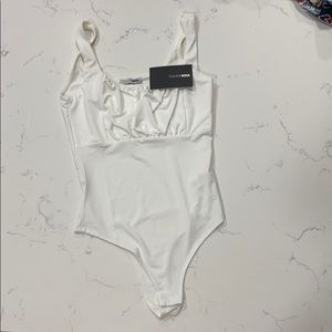 White Fashion Nova bodysuit.